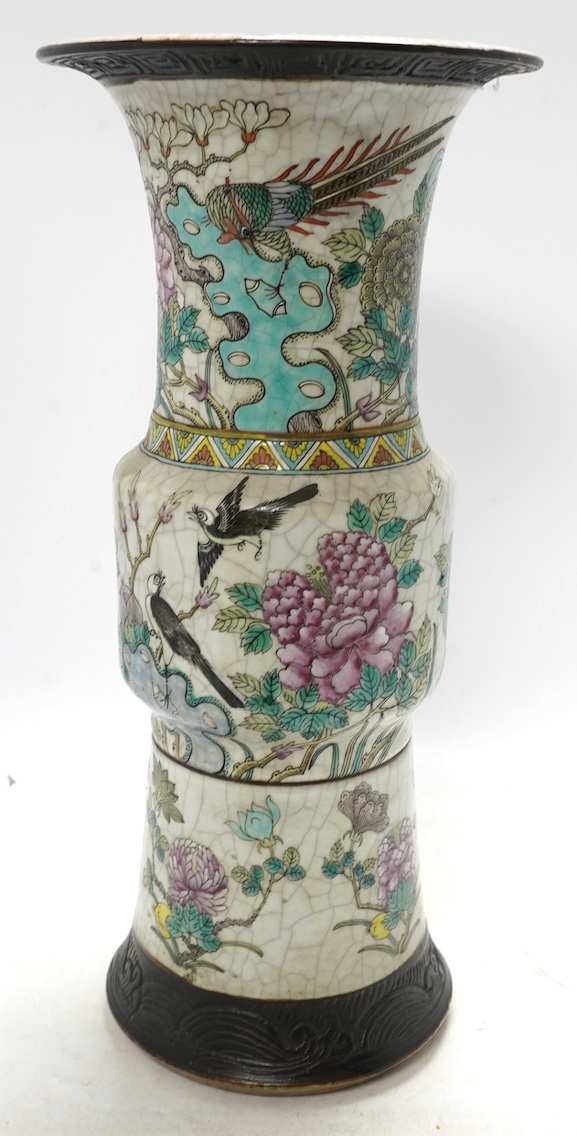 A large Chinese famille rose crackle gu vase, early 20th century, 44.5cm high. Condition - has hole to base where possibly used as a lamp, rest of lamp good